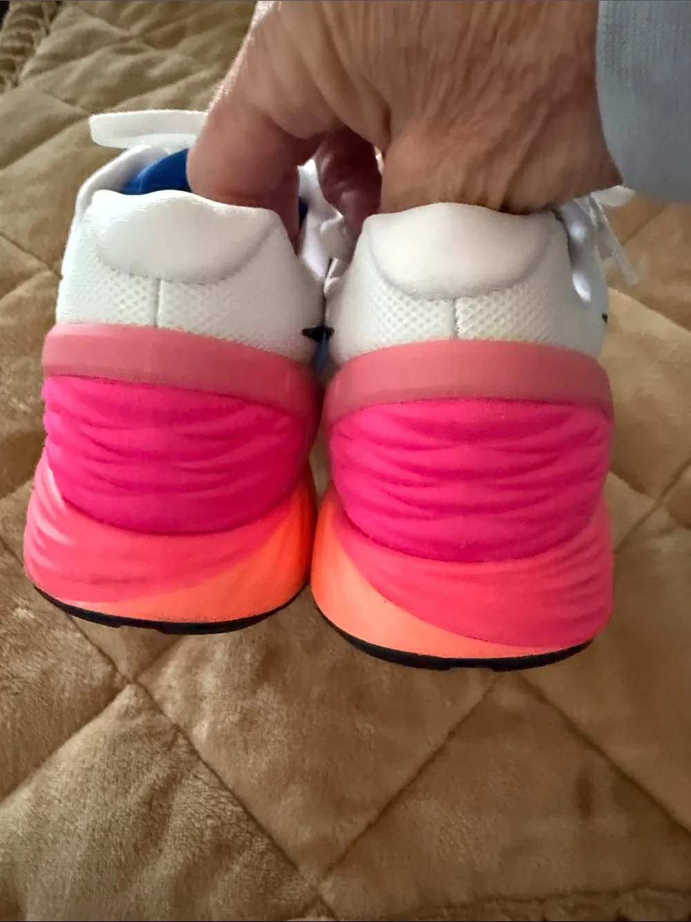 Nike Women's White Running Shoes with Blue and Pink Accents